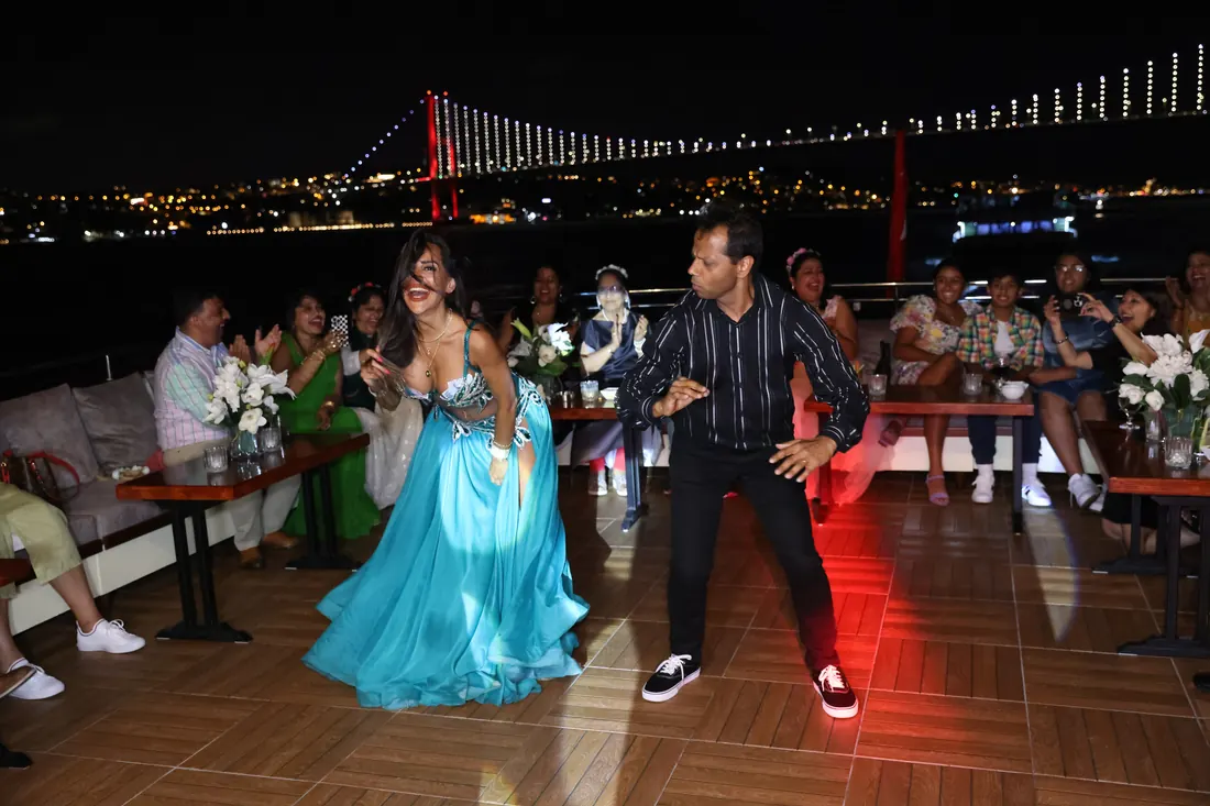 Guests dancing at an anniversary party on a yacht