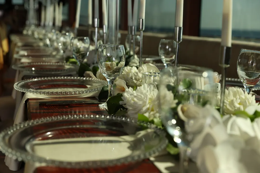 Anniversary table with white flowers and candles