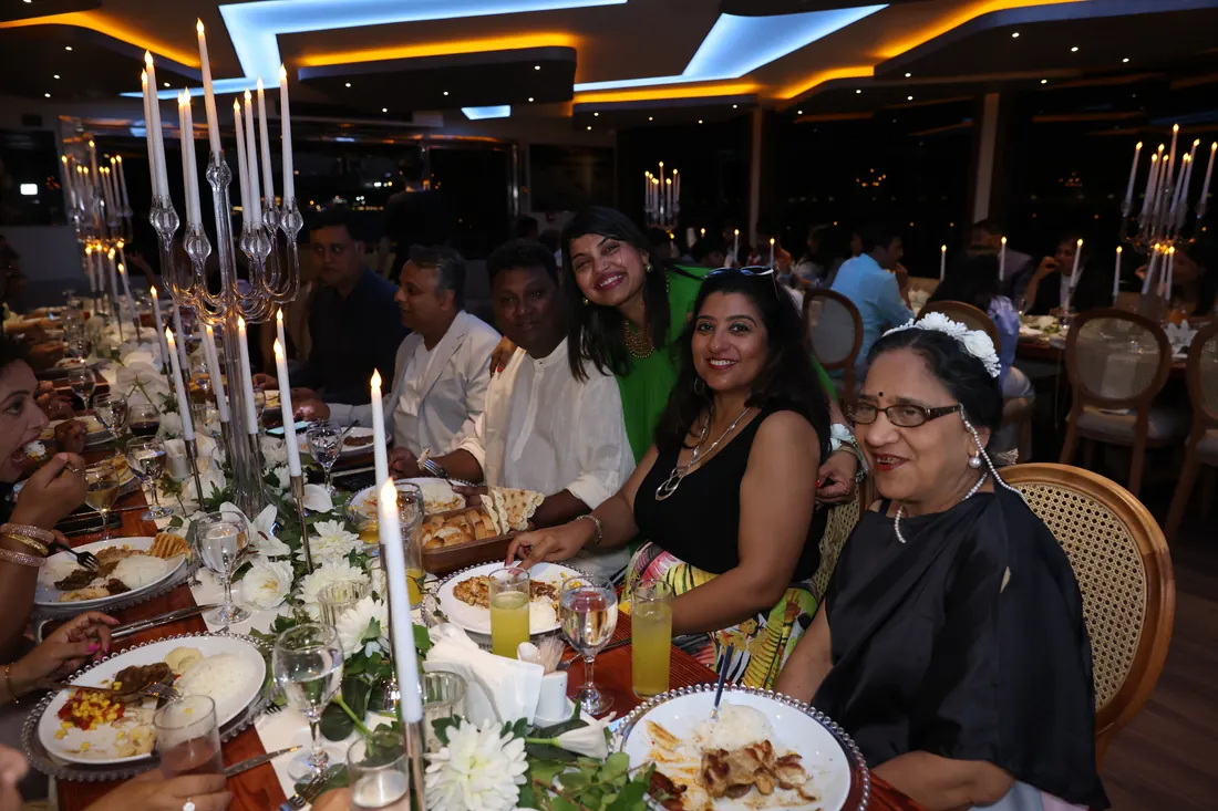 Family anniversary dinner in a yacht saloon