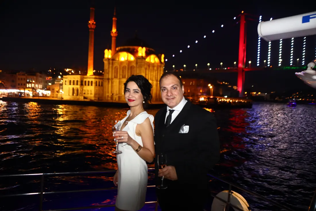 Couple at a birthday party with Ortaköy Mosque at night