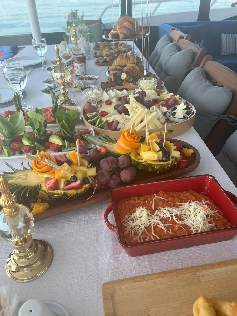 Fruit platter and breakfast dishes on a yacht