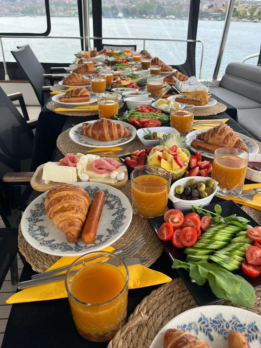 Turkish breakfast spread with croissants, cheeses and fruit