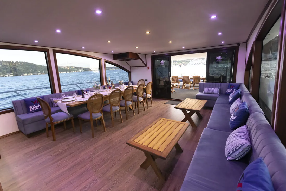 Yacht saloon with a long table for breakfast
