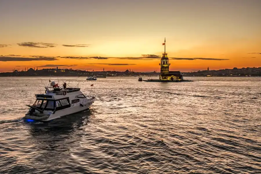 Yacht passing the Maiden's Tower at sunset