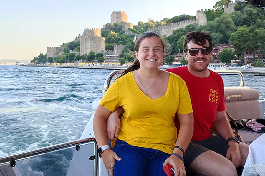 Couple on the yacht passing Rumeli Fortress