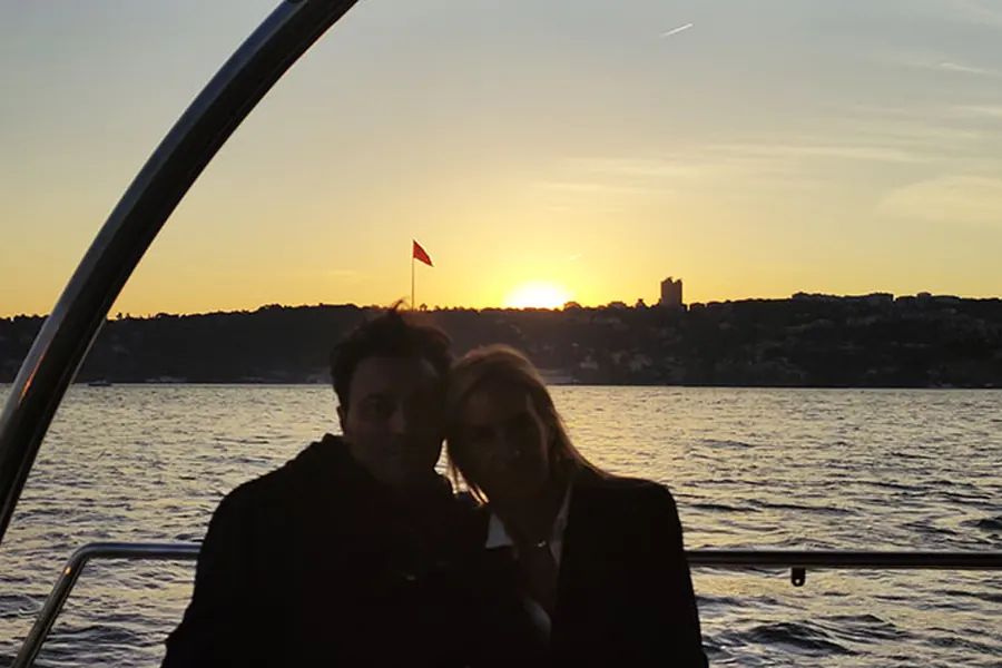 Couple in silhouette as the sun sets behind the Bosphorus hills