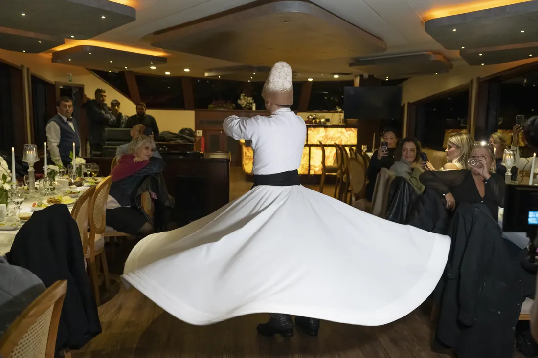 Whirling dervish performing at a gala dinner on a yacht