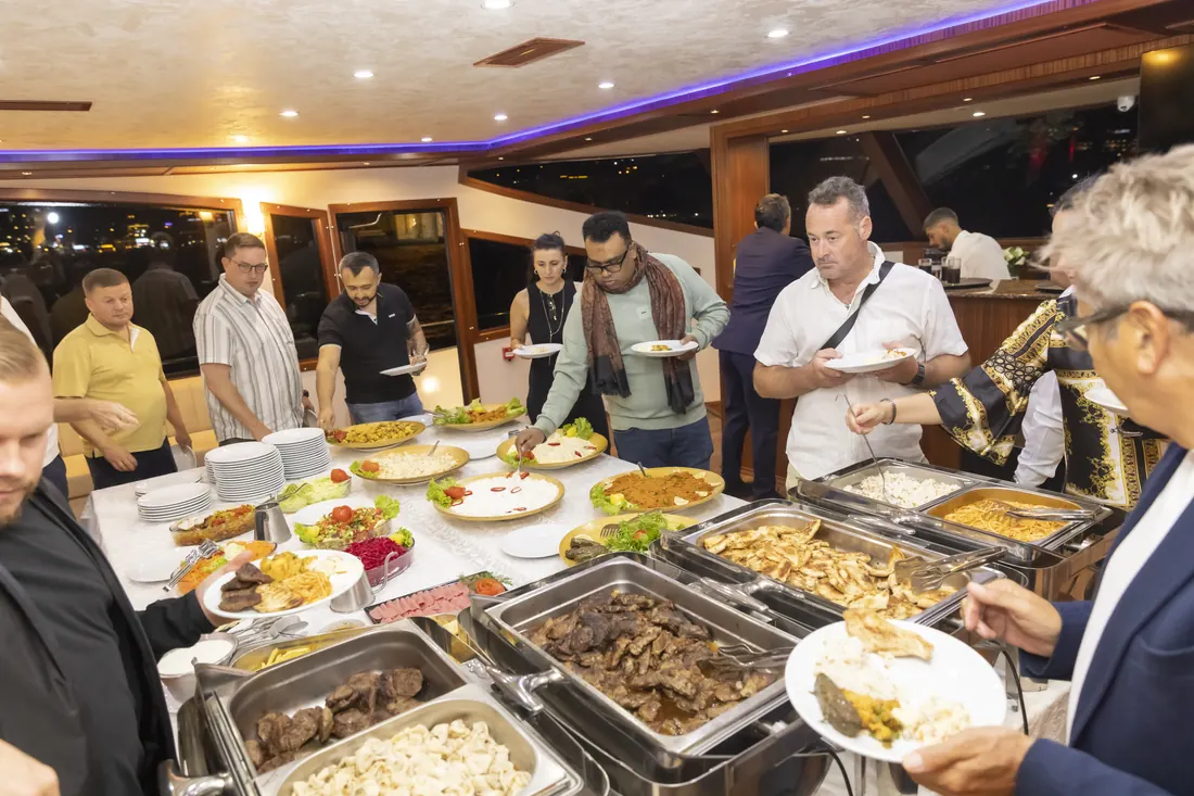 Guests at the buffet during a corporate event on a yacht