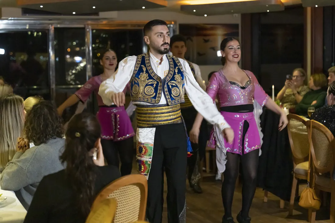 Turkish folk dancers performing at a company dinner on board