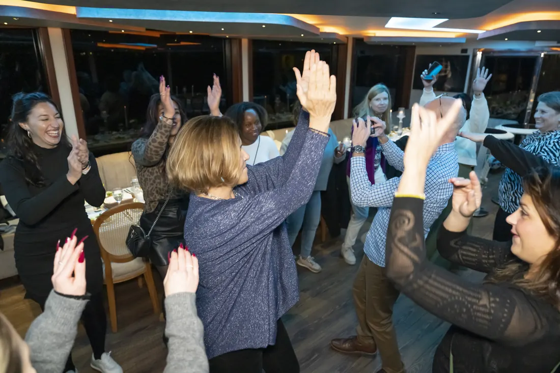 Guests dancing at a corporate yacht party