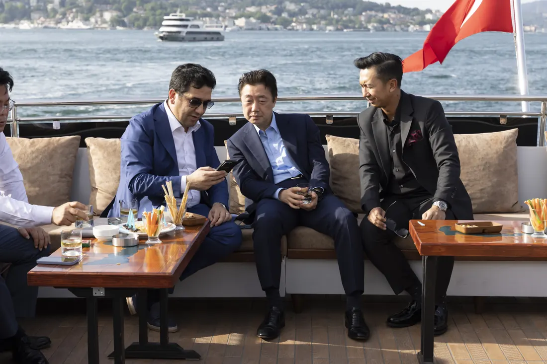 Executives meeting on the deck of a yacht