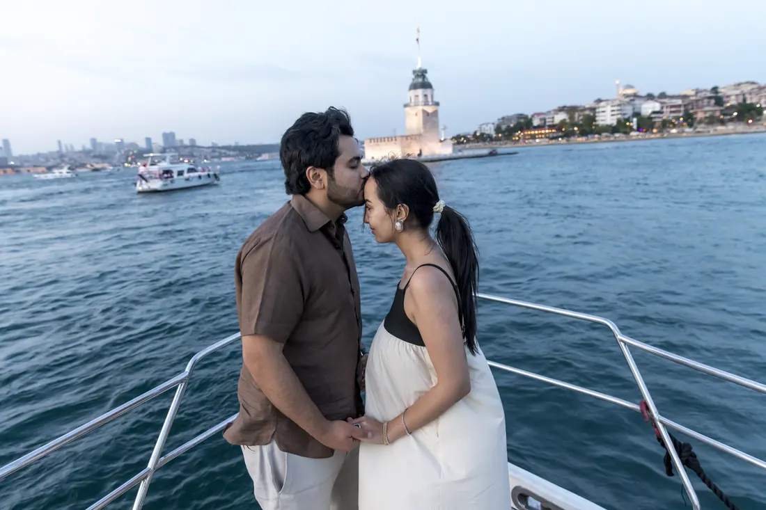 Couple on the bow of a yacht by the Maiden's Tower