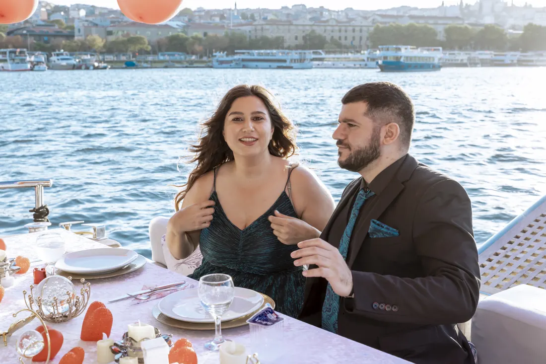 Couple celebrating on a yacht on the Bosphorus
