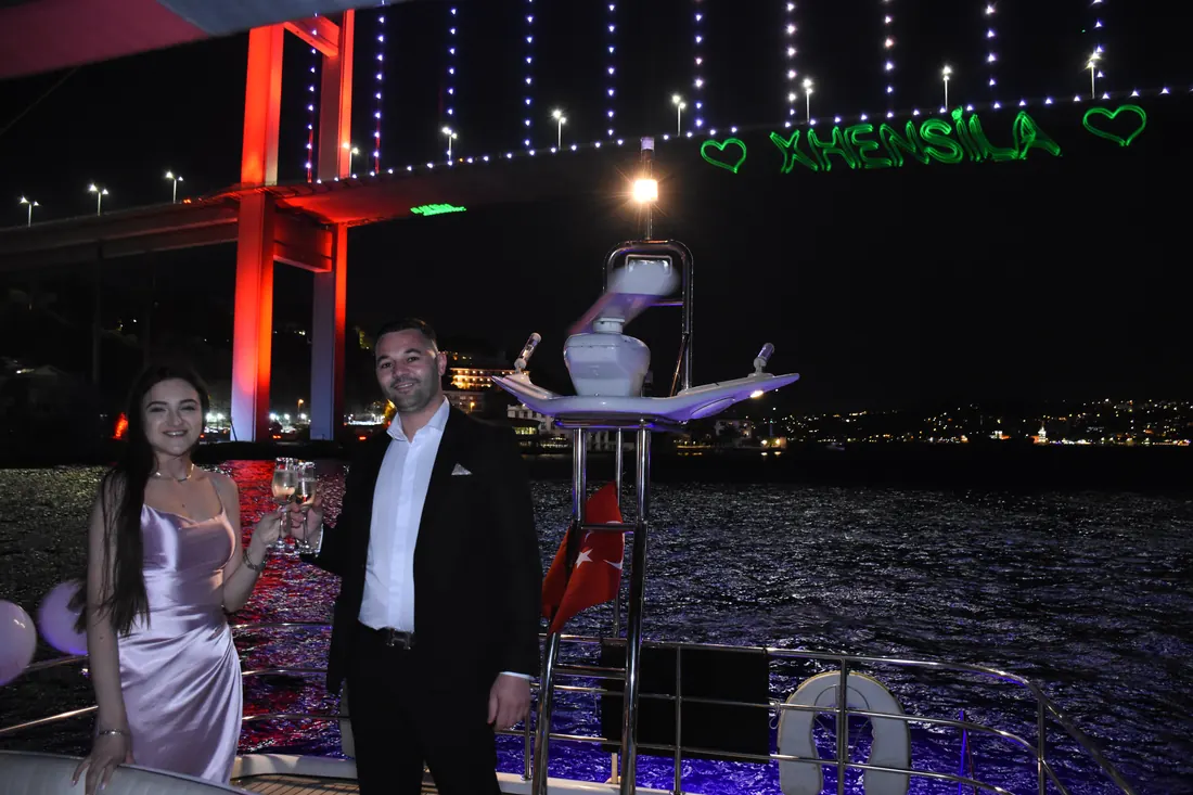 Couple with laser hearts near the Bosphorus Bridge