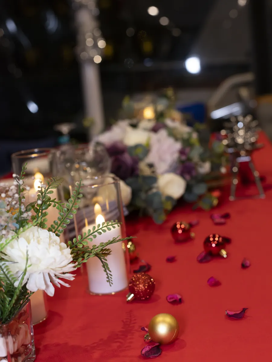Red table decoration with flowers for a proposal