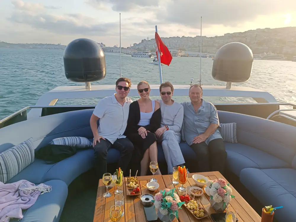 Friends with drinks on a private yacht