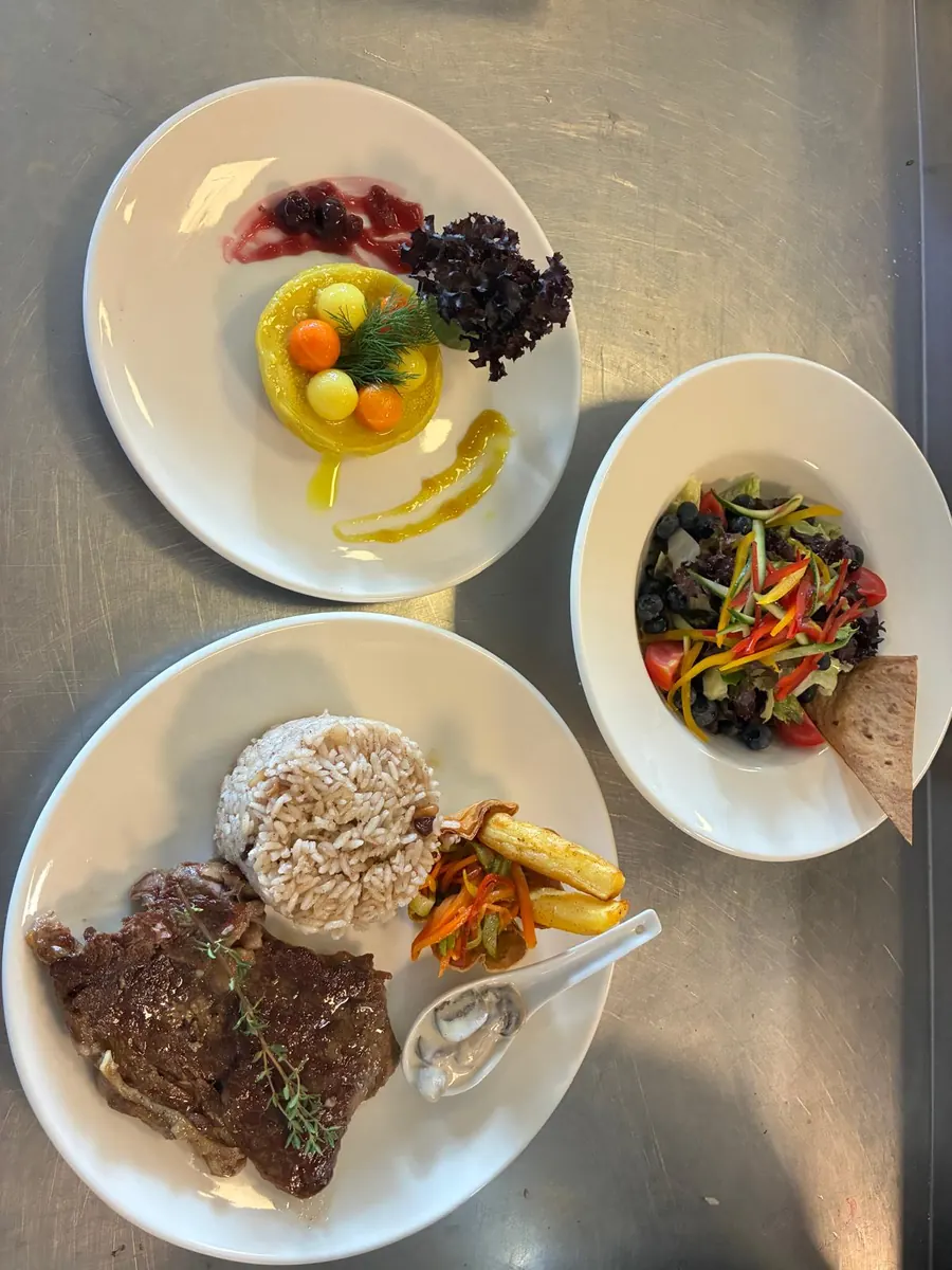 Steak dinner with salad served on a private yacht