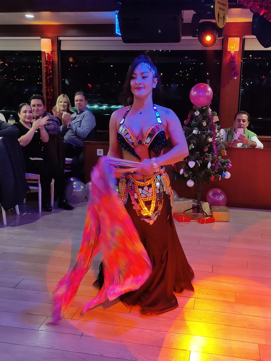 Dancer performing in a yacht saloon on New Year's Eve