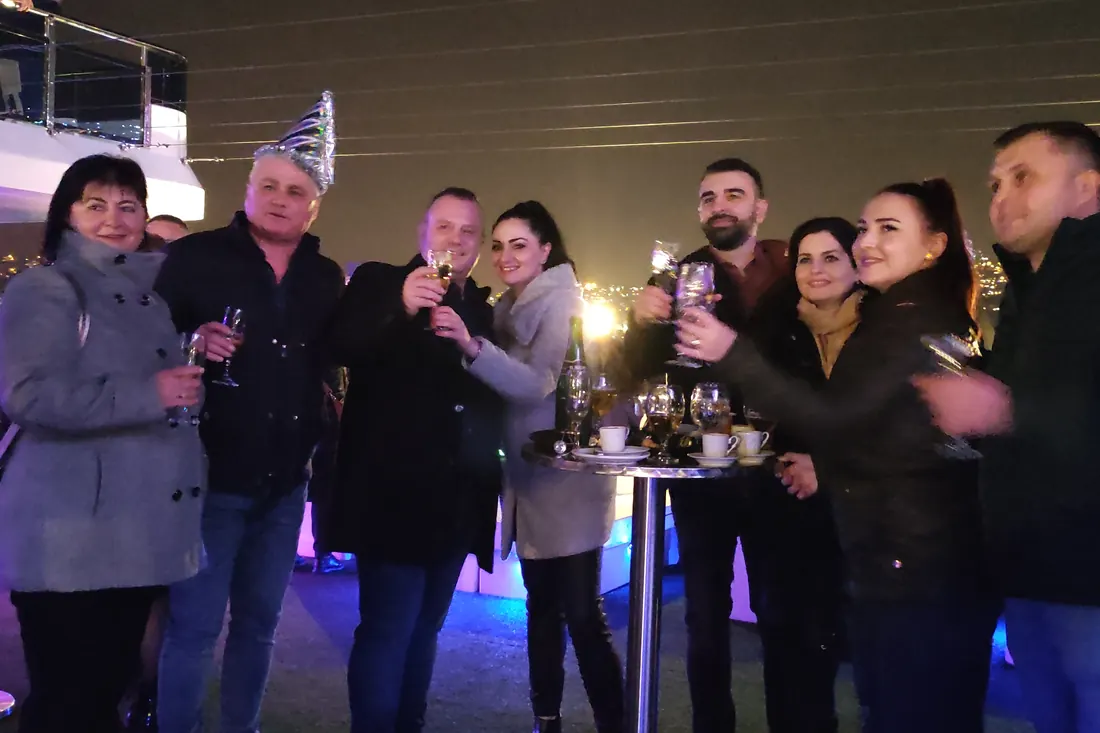 Guests celebrating midnight on a yacht