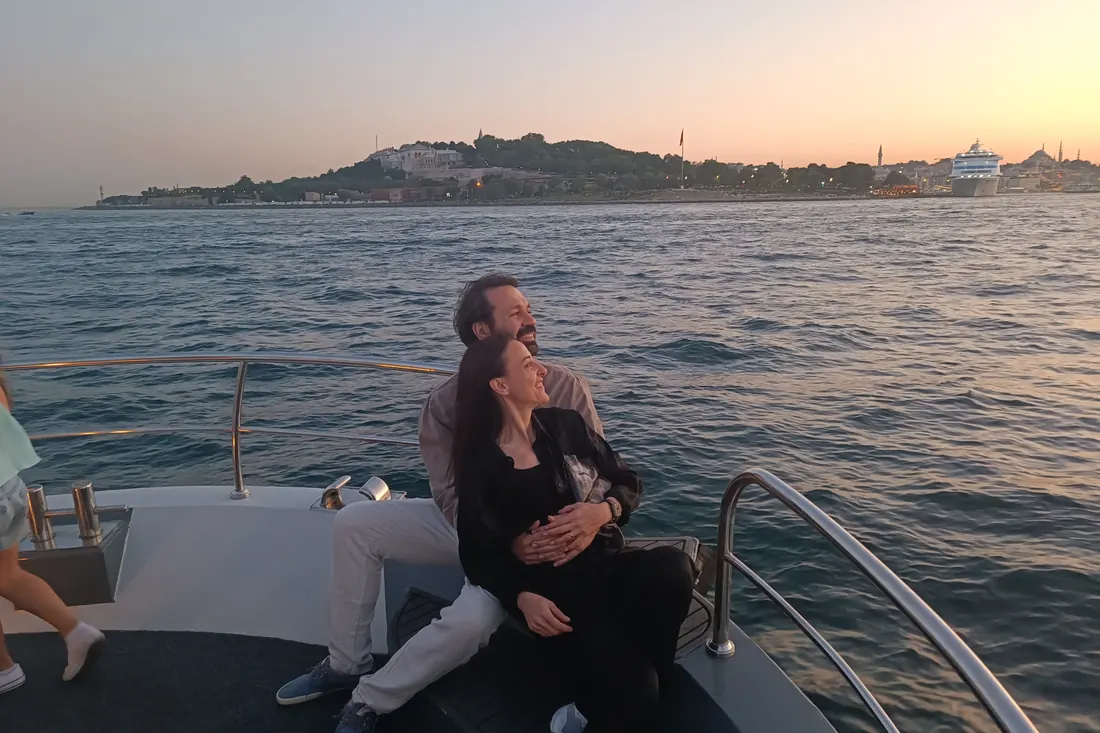 Couple on a private yacht at golden hour