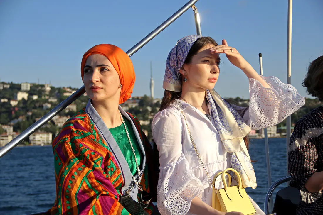 Friends enjoying the view on a private Bosphorus cruise before sunset