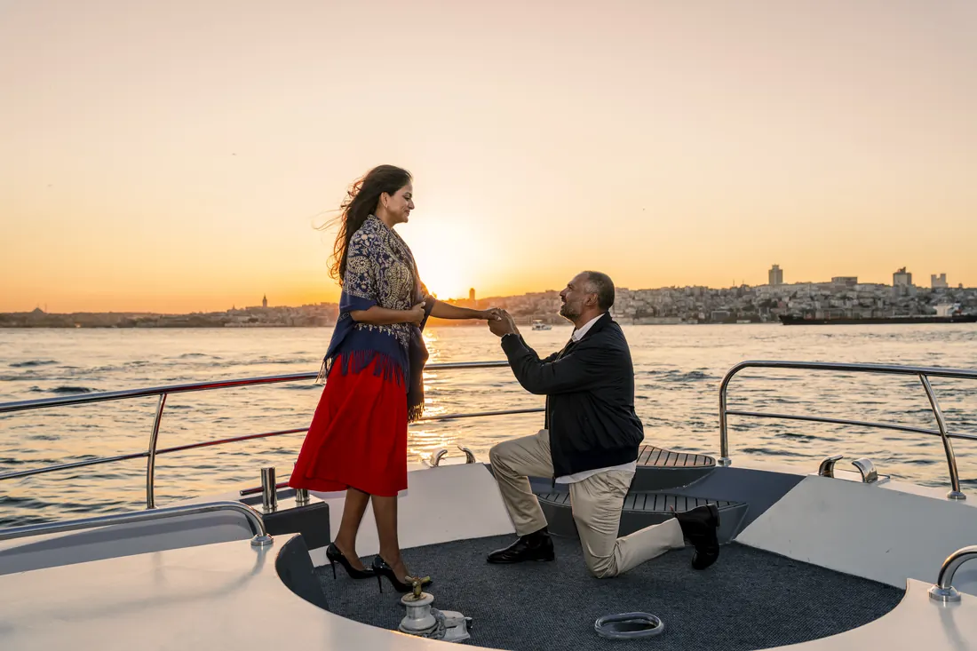 Marriage proposal on the bow of a private yacht at sunset in Istanbul