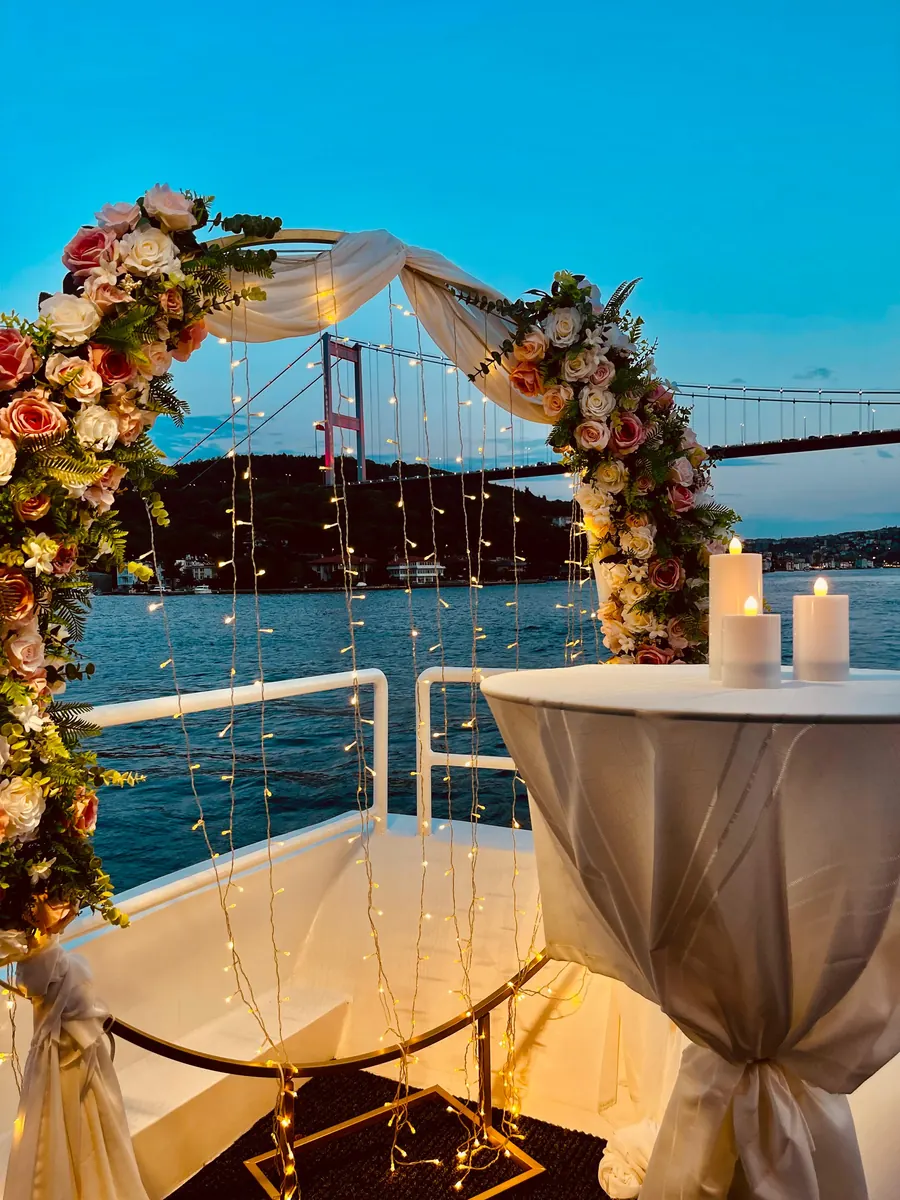 Flower arch on a yacht with the Bosphorus Bridge