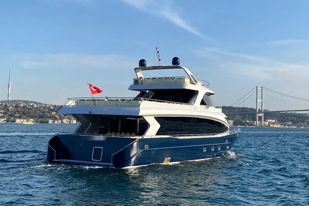 Crescent Star yacht on the Bosphorus with the bridge behind