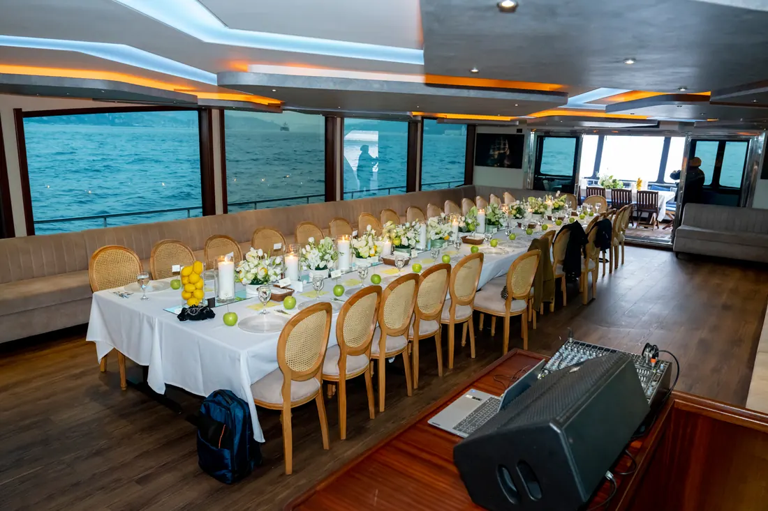 Reception tables set in a yacht saloon