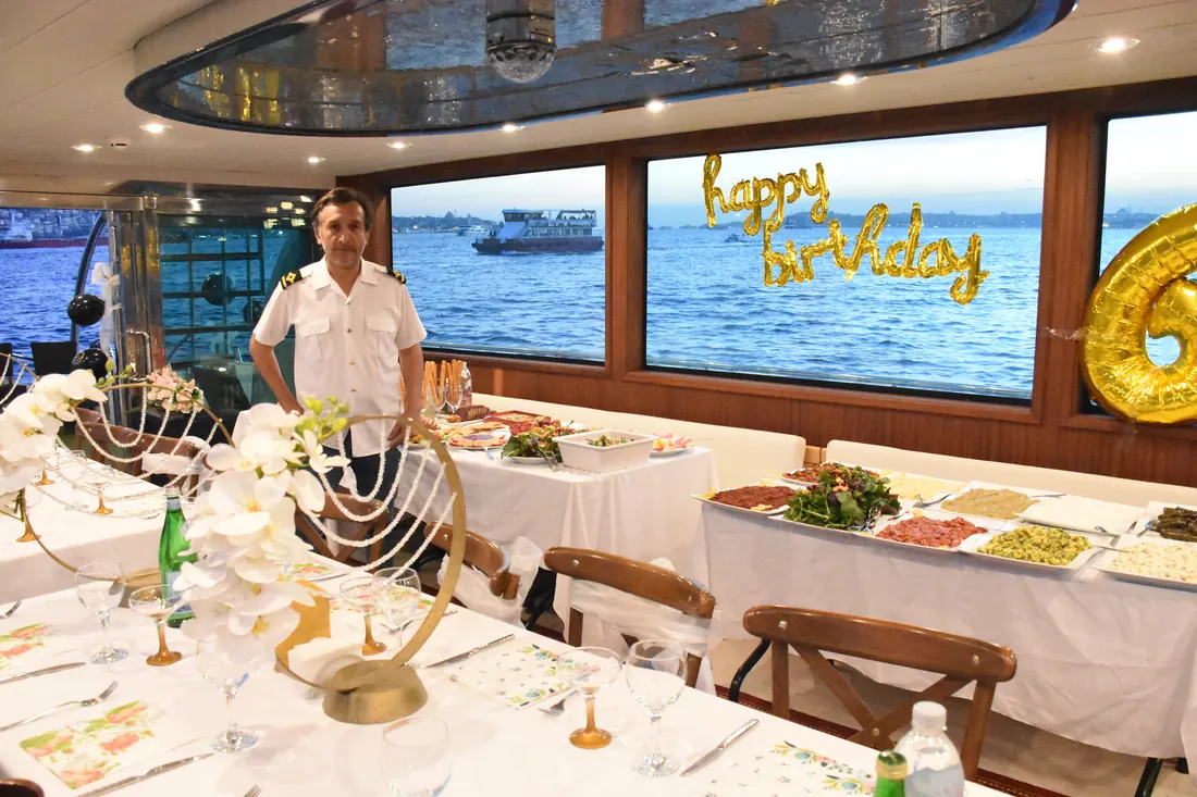 Yacht saloon decorated for a birthday dinner