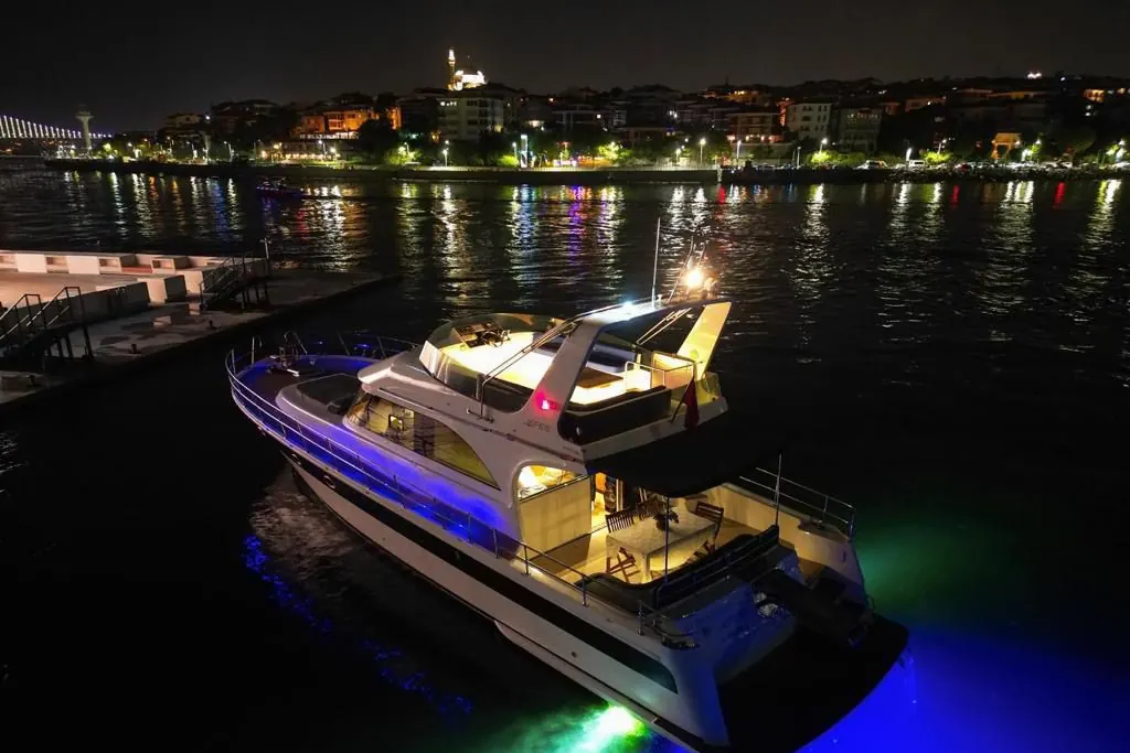 Blue Horizon yacht lit up at night