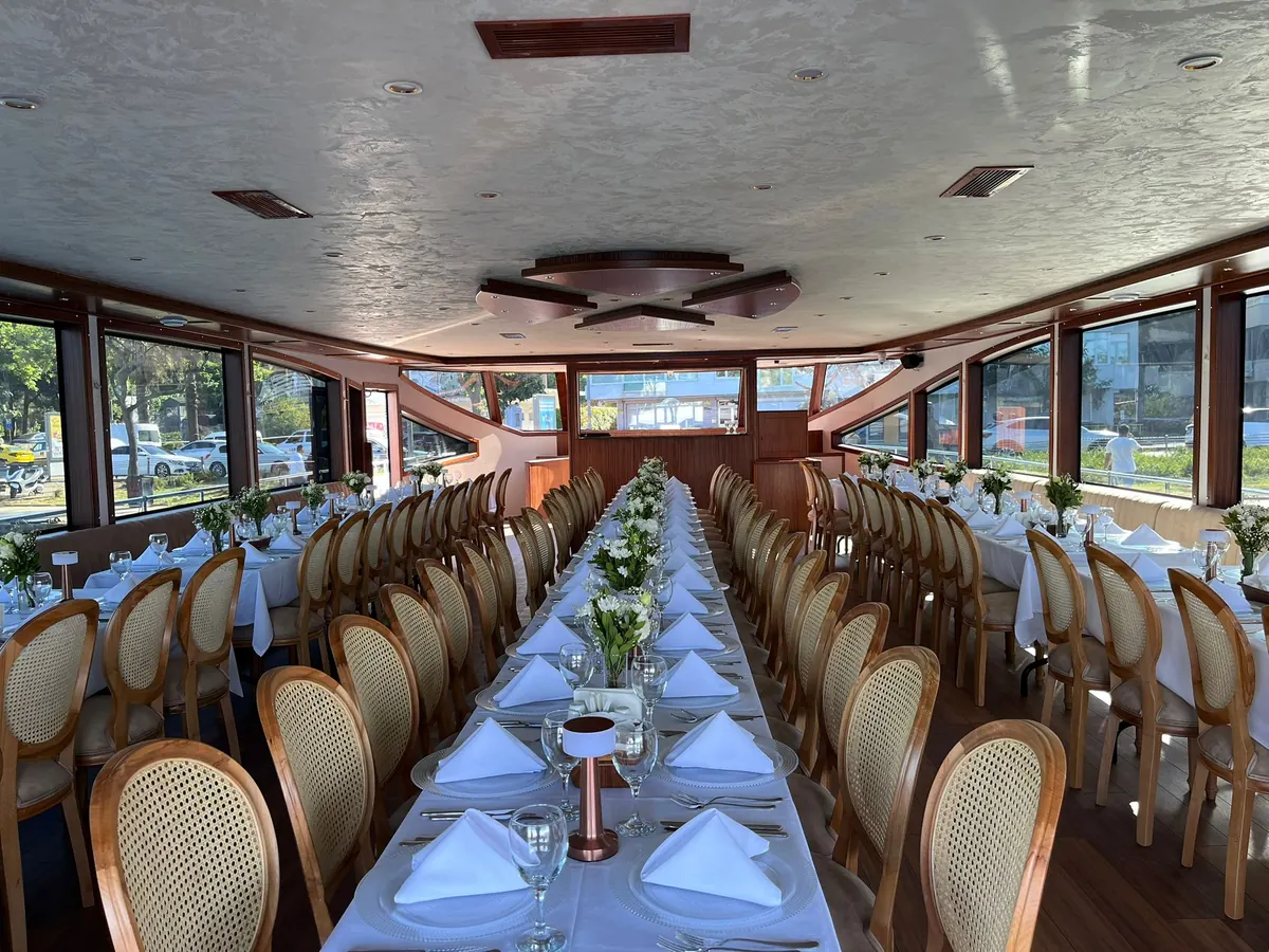 Long dinner tables in the saloon of Crescent Star