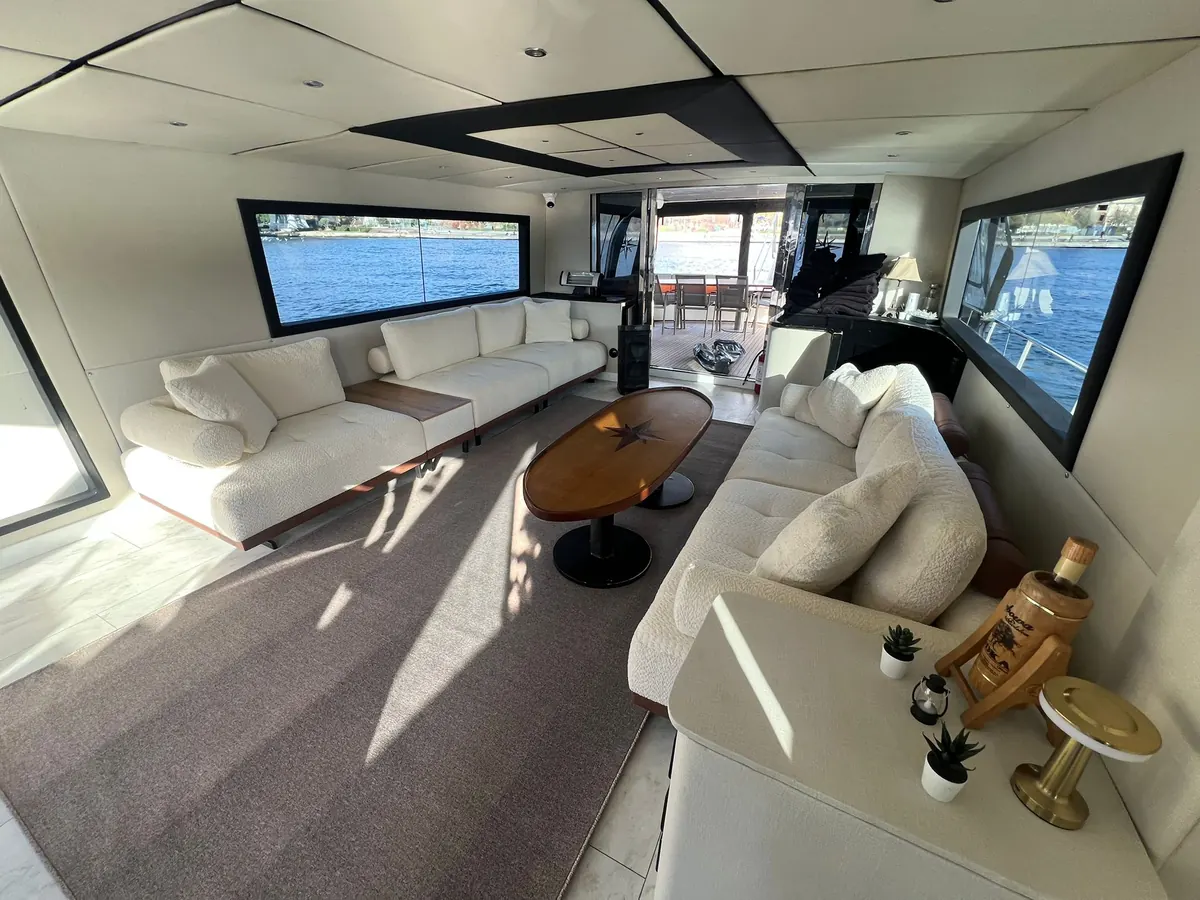 Saloon with white sofas on Ocean Breeze