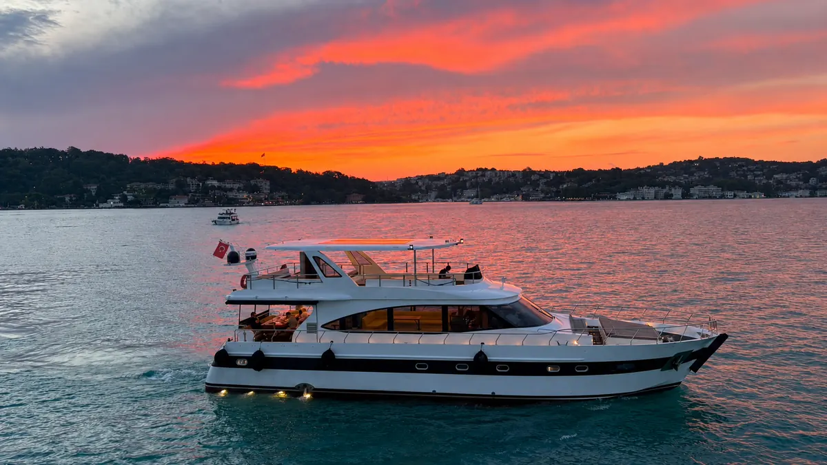 Sea Fairy yacht under a red sunset sky