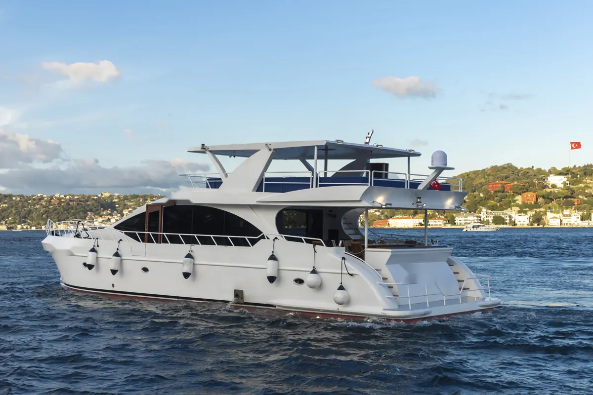 White Istanbul motor yacht cruising on the Bosphorus