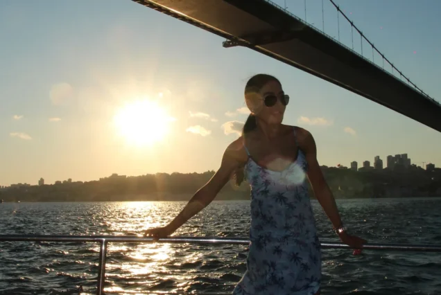 Guest with the Bosphorus Bridge at sunset on the cruise